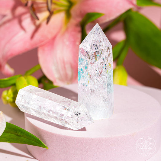 Ice quartz crystal point with transparent, sparkly facets