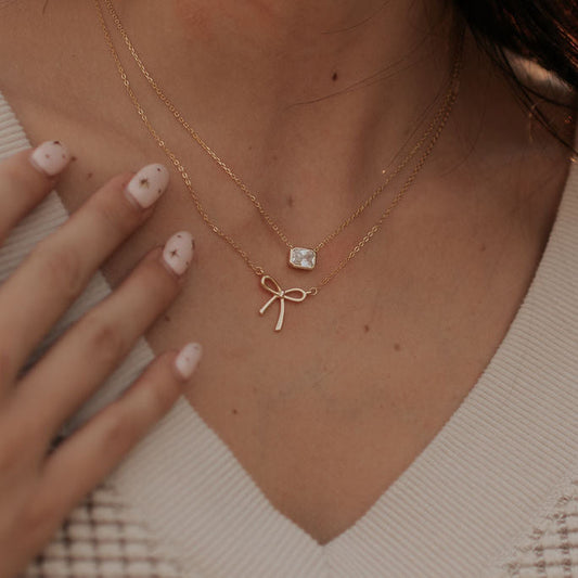 Gold Blair Diamond Necklace with rectangular stone pendant, worn on a fine chain