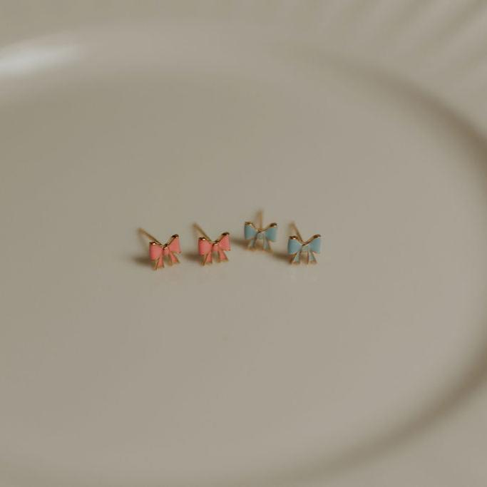 Pink and baby blue enamel bow stud earrings with gold-tone settings