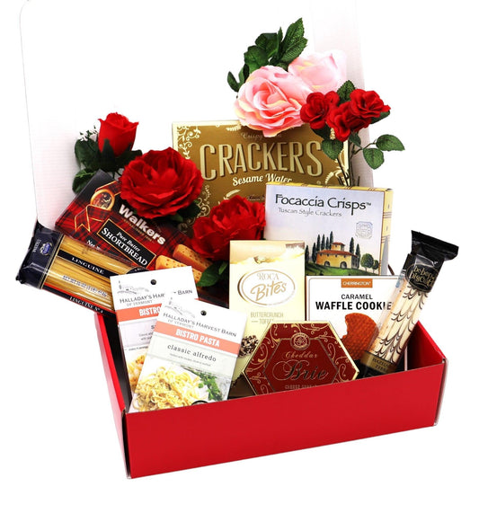 Red gift box with assorted crackers, cookies, wafers, and roses