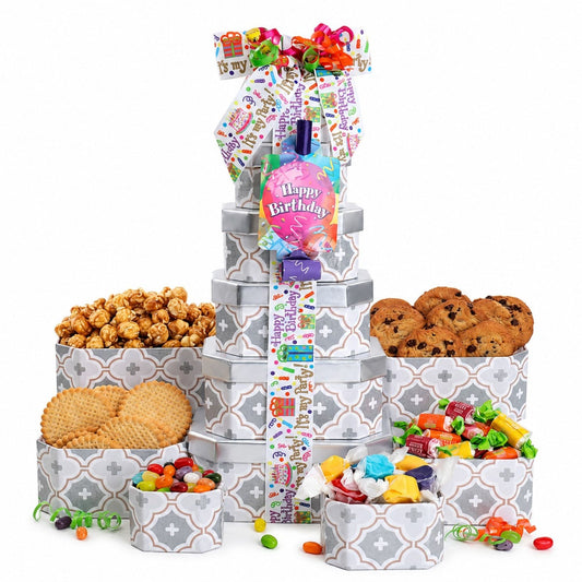 Birthday treat gift tower with gray patterned boxes, ribbon topper, and assorted candies