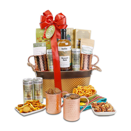 Ginger beer gift basket with red bow, copper bucket, ginger beer bottle, and snacks