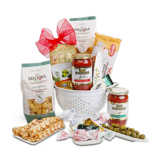 Pasta gift basket with white basket, pasta bags, marinara jars, olives, crackers and cookies