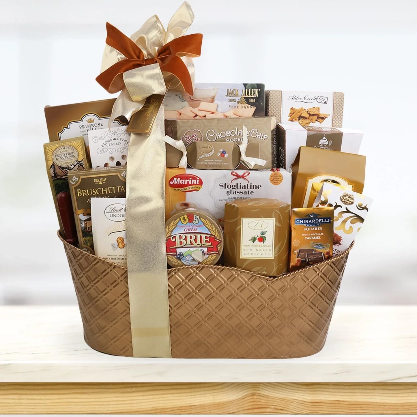 Corporate VIP Gift Basket in wicker weave, orange bow and assorted gourmet packages