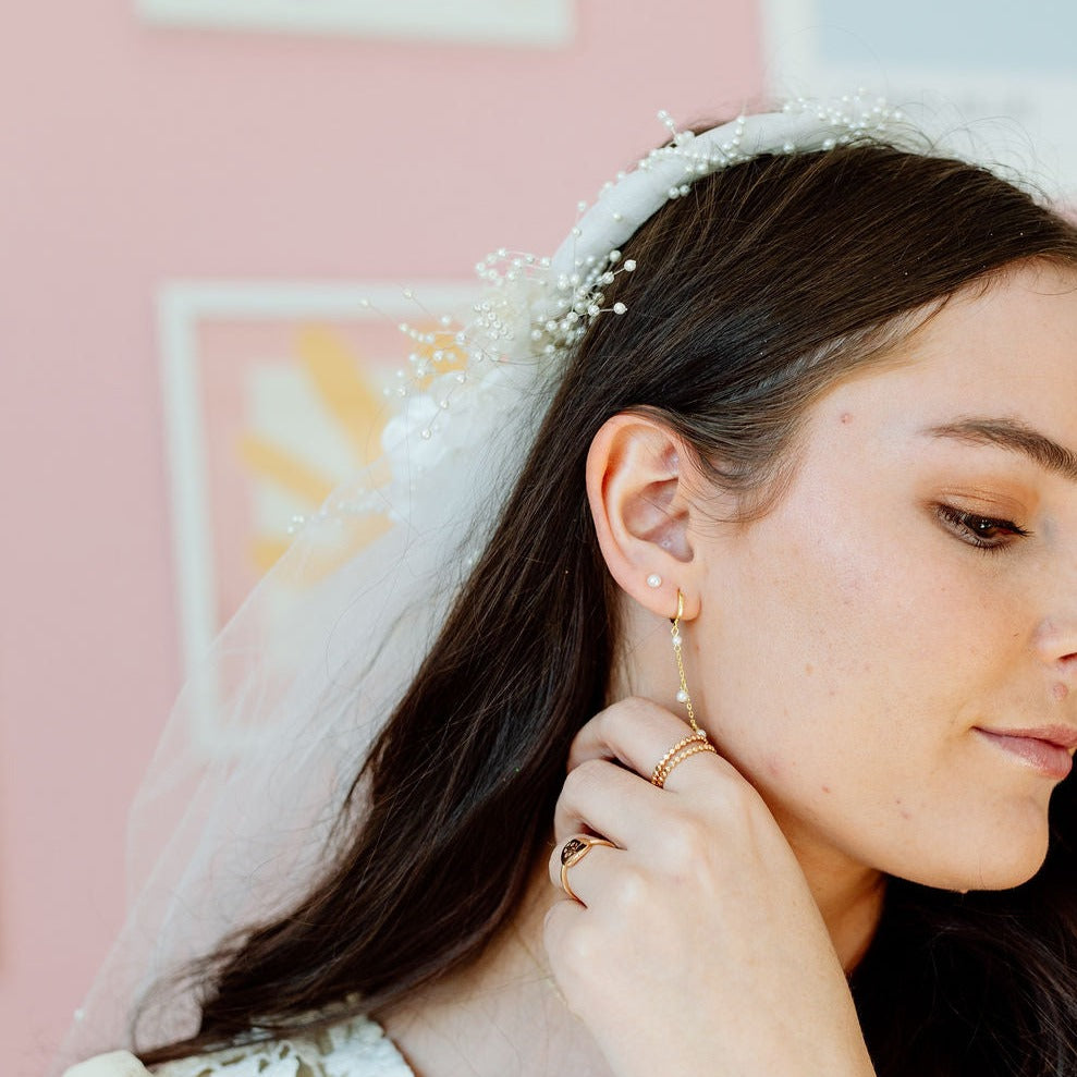 Sailor Pearl Stud worn with a long pearl drop earring