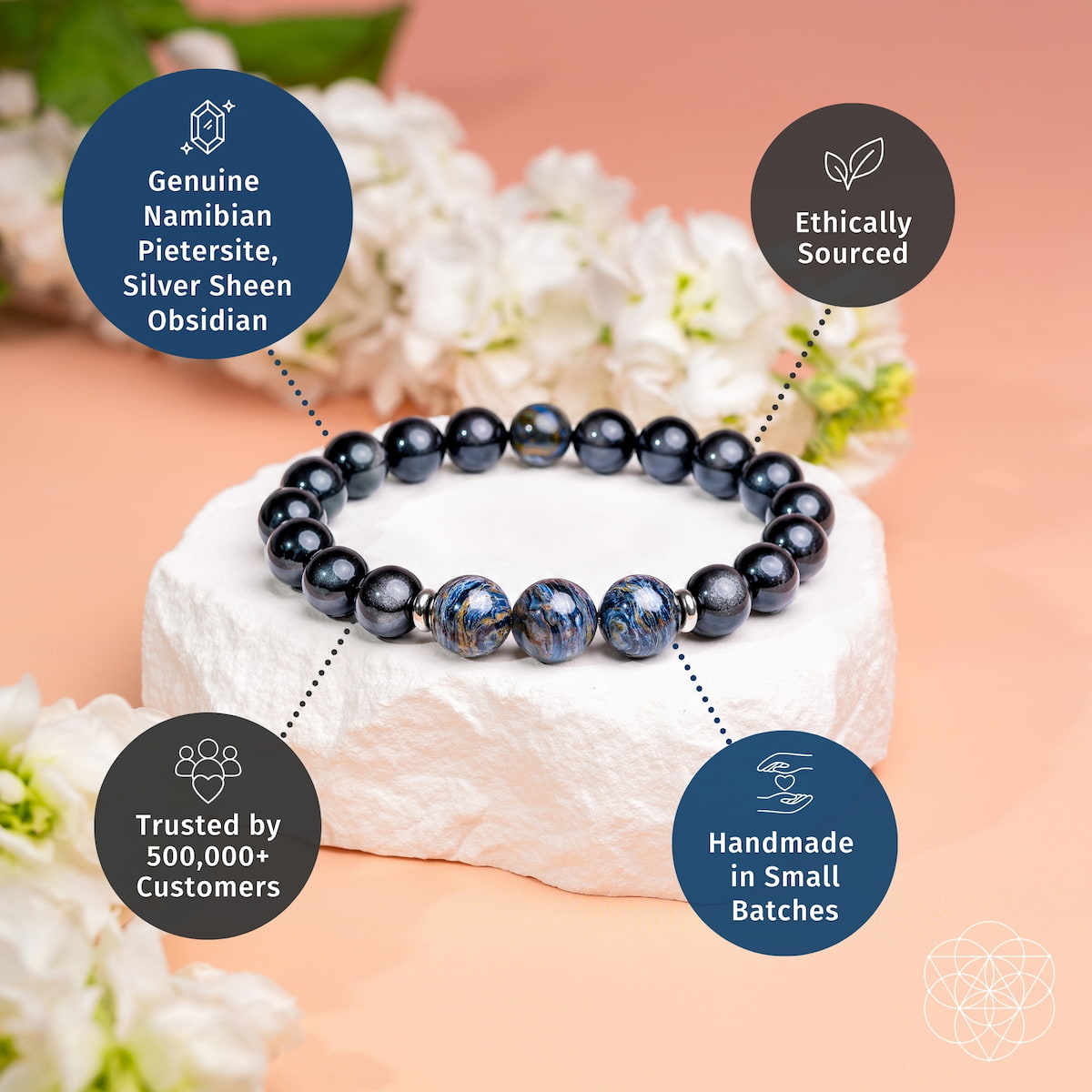 Dark beaded bracelet with three blue pietersite-style accent stones on a rounded strand