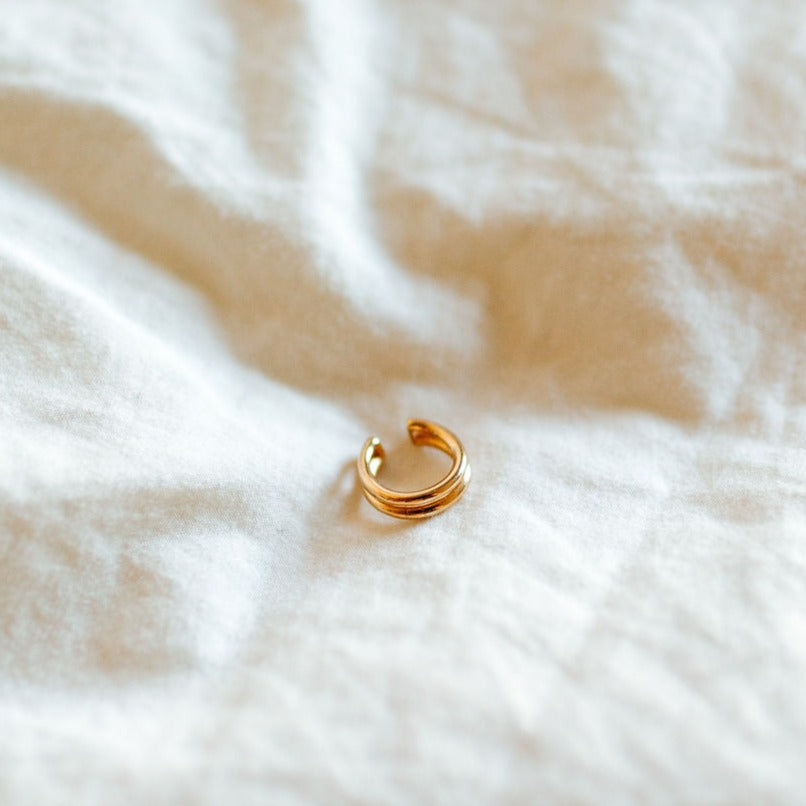 Gold-filled double-band ear cuff with an open, curved design