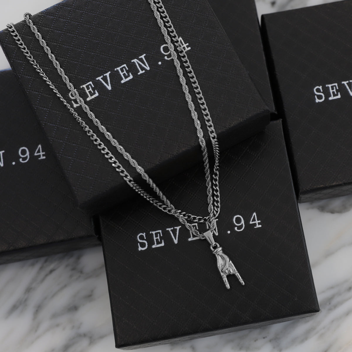 Silver horn-hand pendant necklace set with SEVEN.94 gift boxes