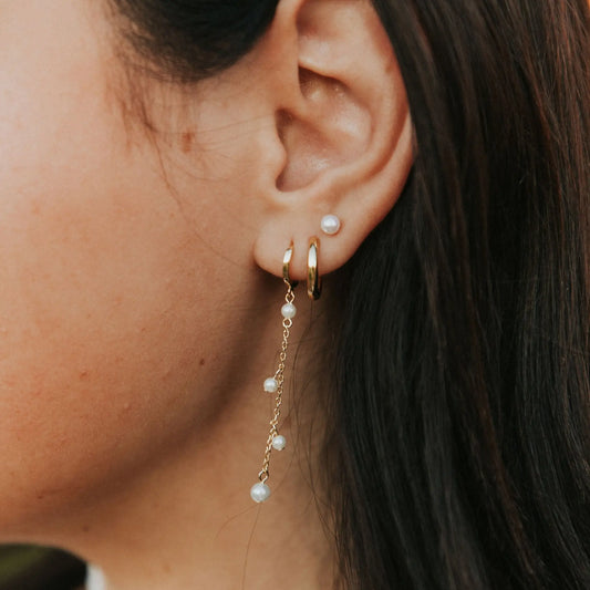 Sailor Pearl Stud worn above gold hoops and dangling pearl earrings
