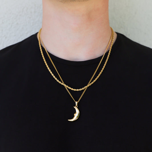 Gold crescent moon pendant necklace with layered chains and moon charm