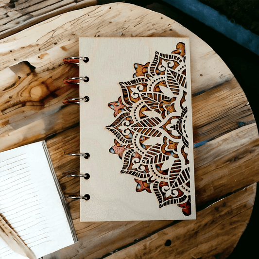 A6 mandala notebook with wood cover, metal rings, and brown ornamental artwork