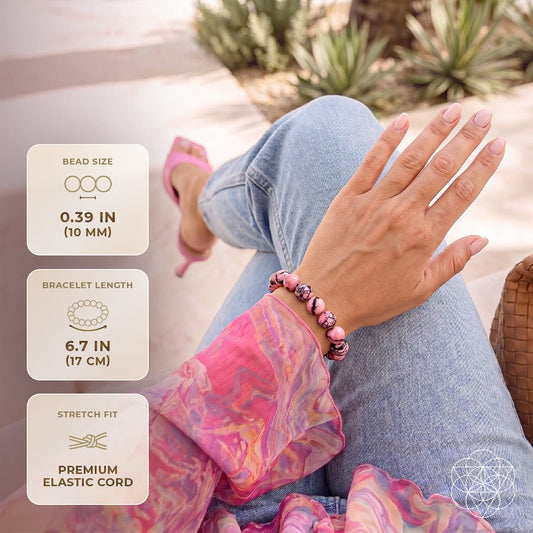 Rhodonite bead bracelet on wrist with pink and black marbled stone beads