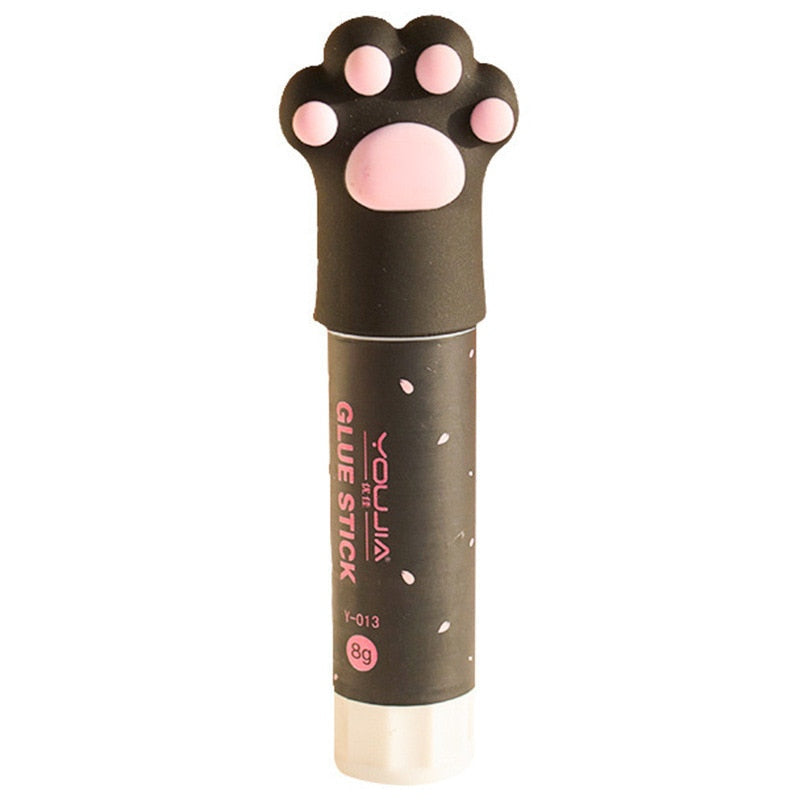 Black cat paw glue stick with pink paw-print cap and clear glue tube