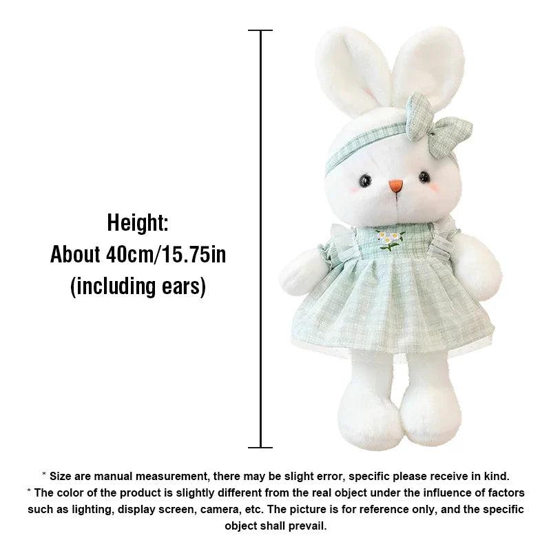 Mint green bunny plush doll in a ruffled dress with bow headband