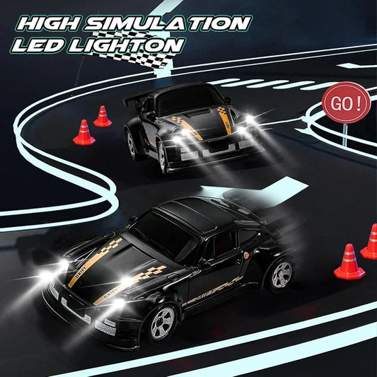 Mini RC drift car with bright LED headlights on a black track with cones