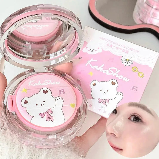 Open air cushion foundation compact with pink cushion insert and clear lid, plus product box