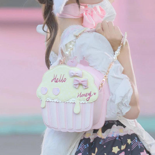 Cupcake-shaped bag with light mint top and white/pink striped base, bow and 'Hello' script