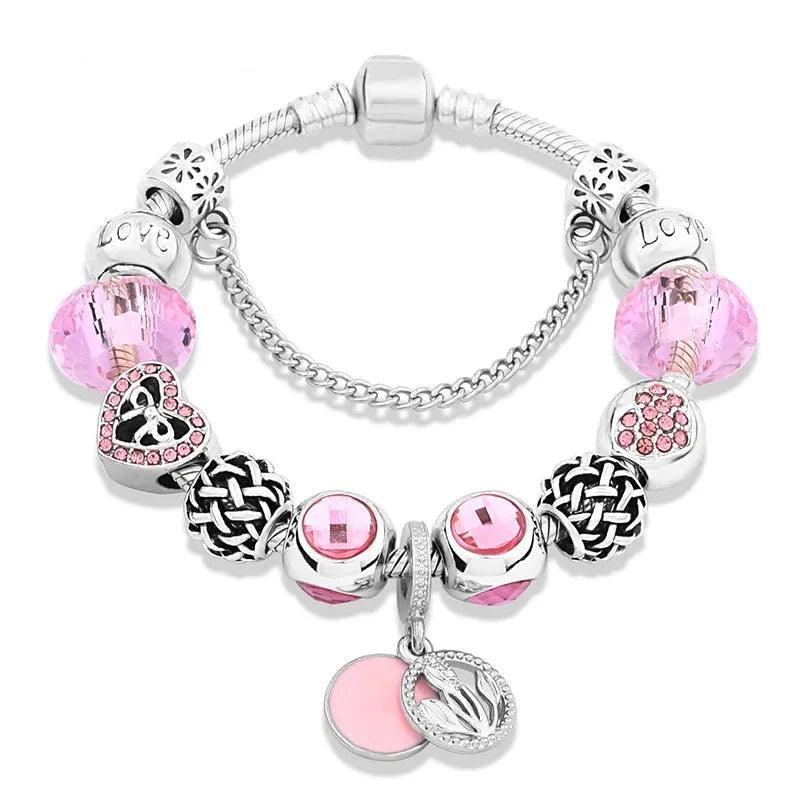 Pink charm bracelet with silver beads and pink stones; heart and leaf pendants