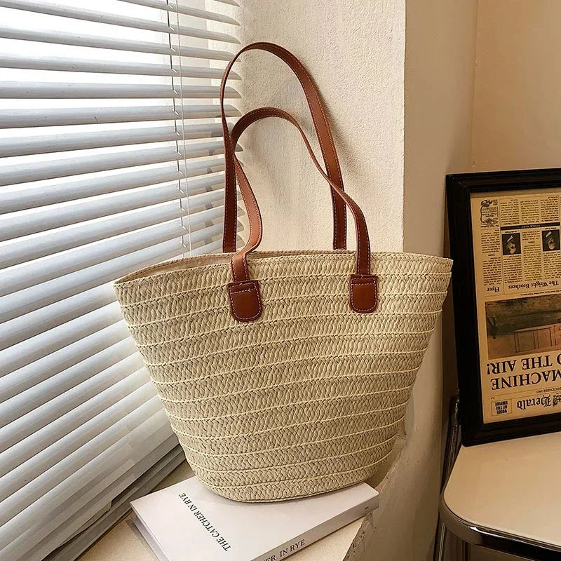 Light straw woven shoulder tote bag with brown faux-leather handles