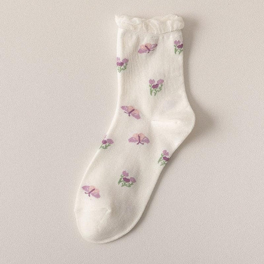 White floral socks with small purple and green flower prints