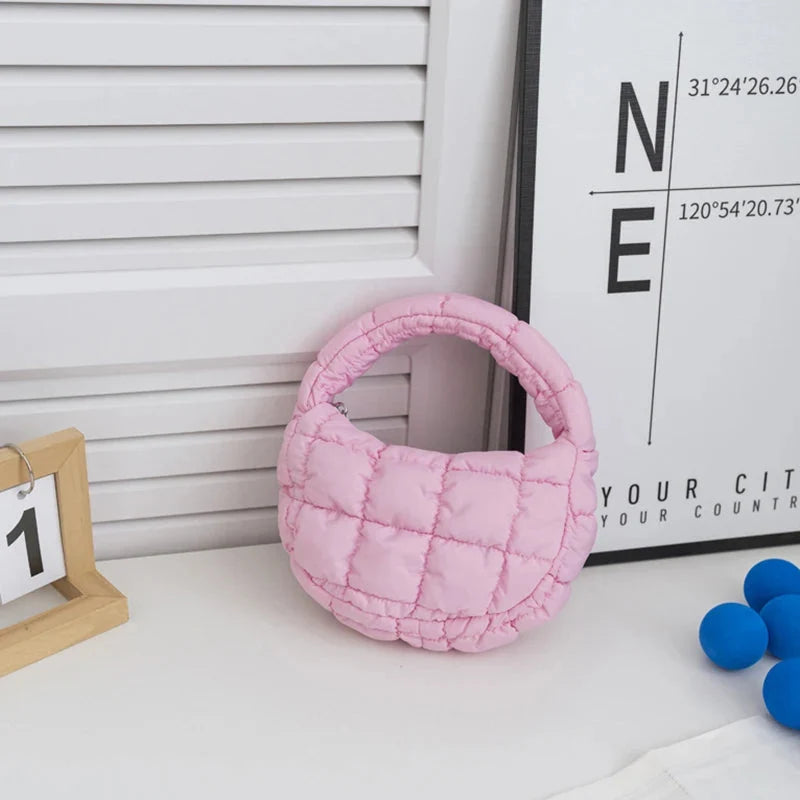 Quilted puffer circle mini bag with top handle, rose pink padded nylon.