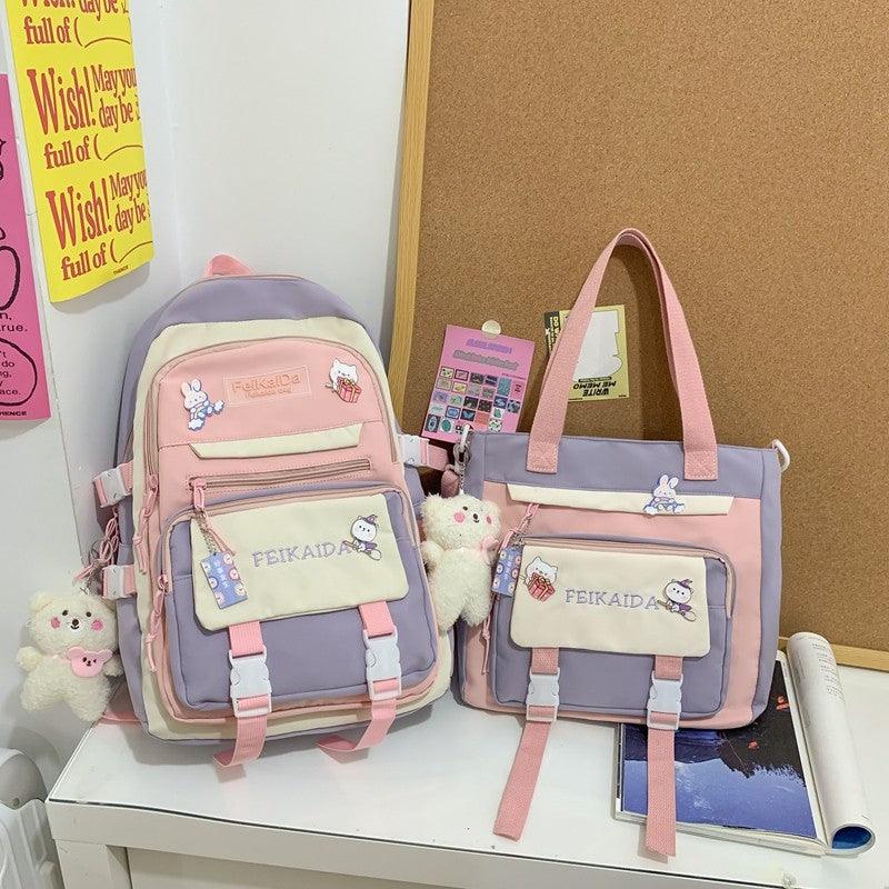 Waterproof pink mini backpack with lavender body and matching tote bag set with charms