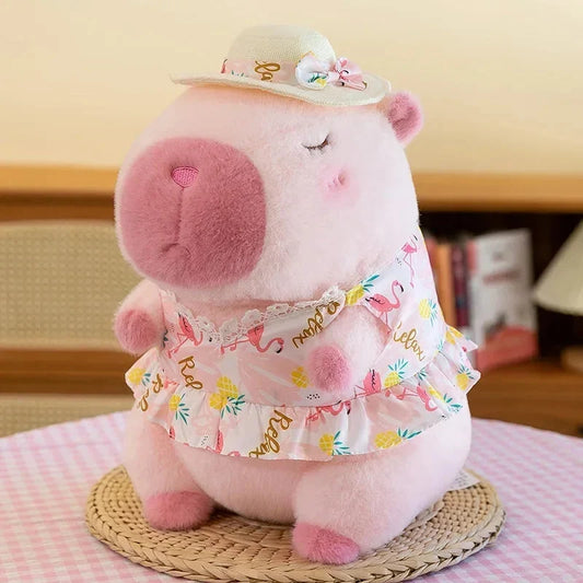 Light pink plush capybara doll with floral dress and pastel bow hat