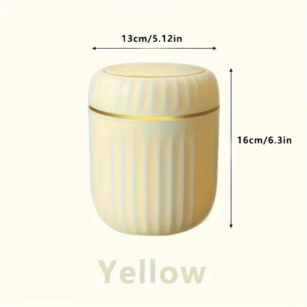 Yellow mini desktop trash can with lid, ribbed plastic container, gold trim