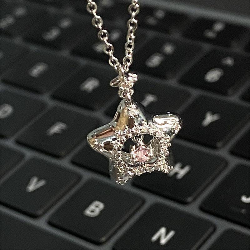 Silver star pendant necklace with pink gem halo and sparkling pave on a chain