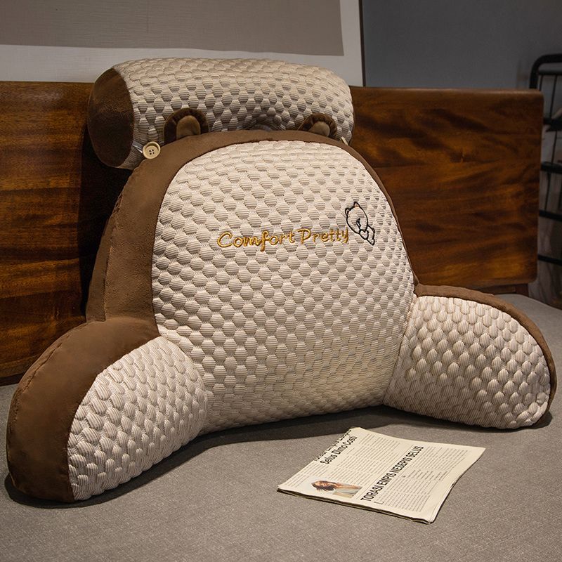 White and brown plush reading pillow with honeycomb texture and curved cuddle support