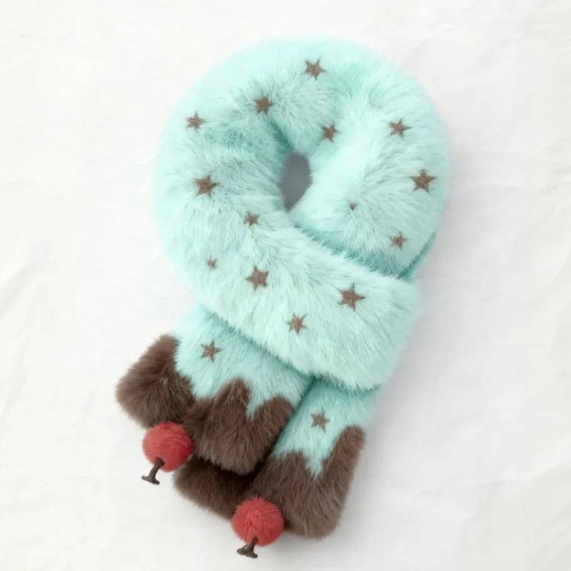 Plush scarf in teal with star pattern, brown cuff, and red pom-pom accents