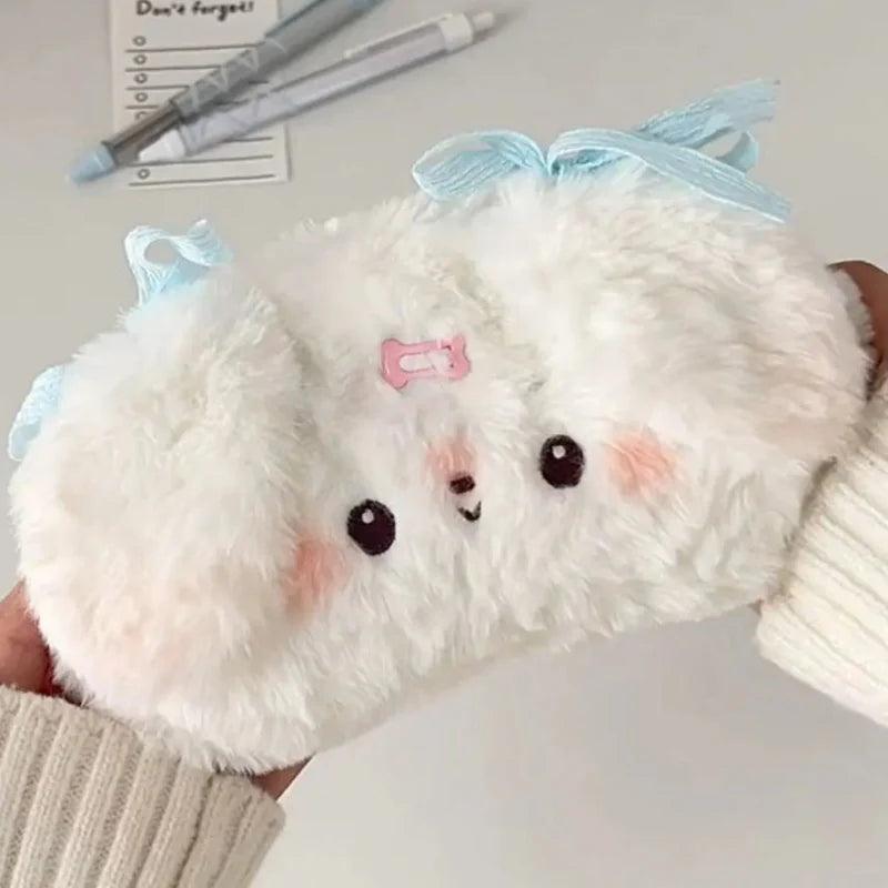 Plush puppy pencil bag in white plush with light blue bow and stitched face