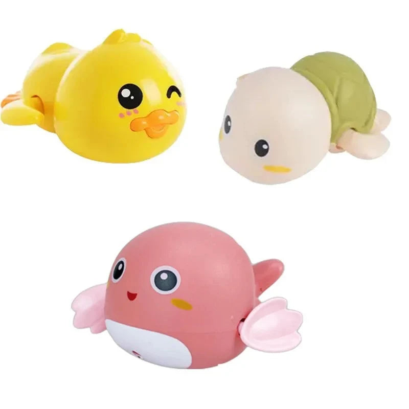 Set of 3 floating bath animal toys: yellow duck, green turtle, pink dolphin