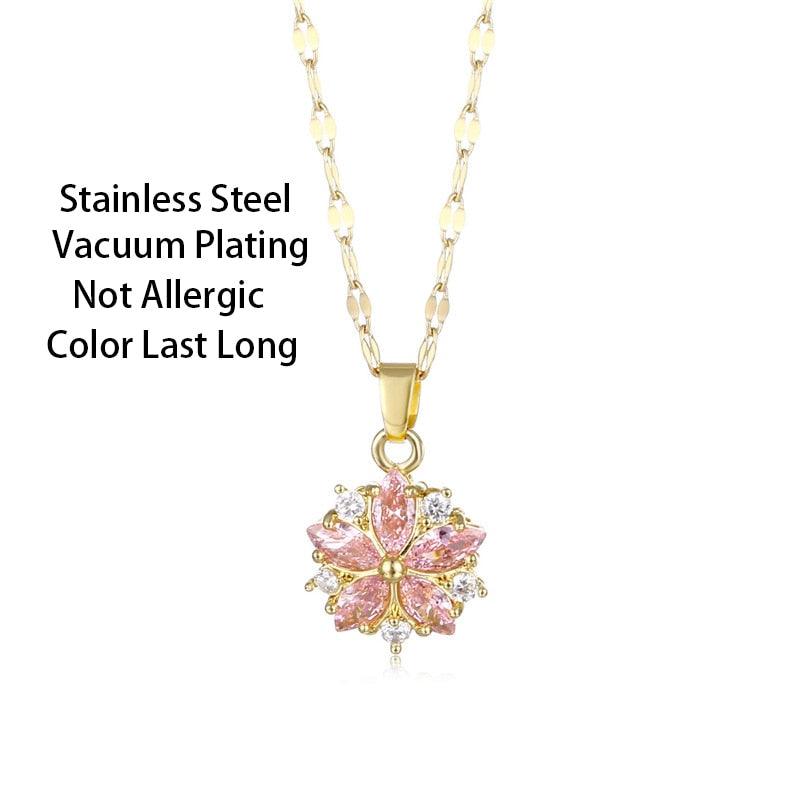 Gold-tone cherry blossom pendant necklace with pink crystal petals and clear sparkle stones