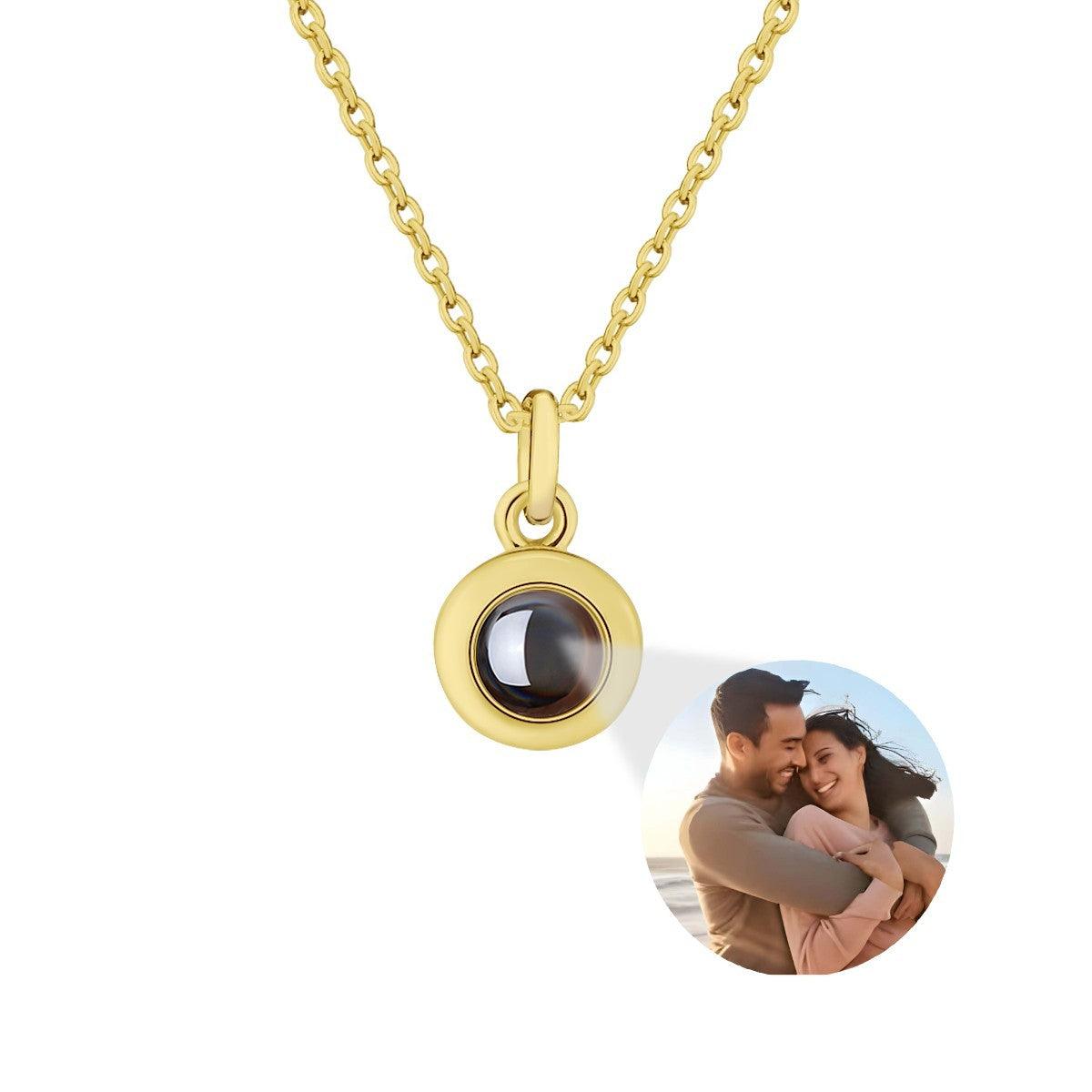 Gold photo projection necklace with round locket pendant and chain
