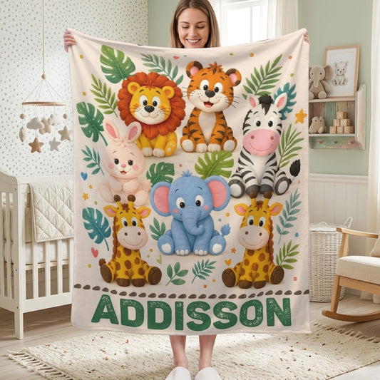 Personalized safari name blanket held up, cream with jungle animals and ADDISON lettering