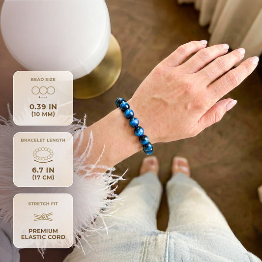 Blue tiger’s eye beaded bracelet on open palm, glossy round beads