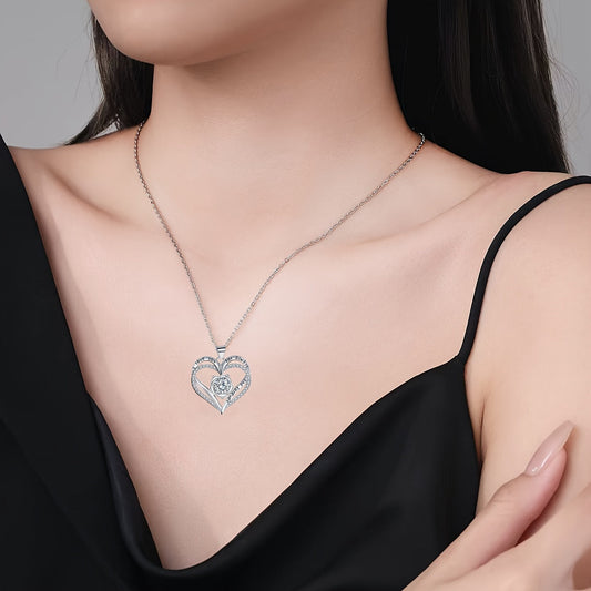 Heart gemstone pendant necklace on neckline, silver chain with heart charm