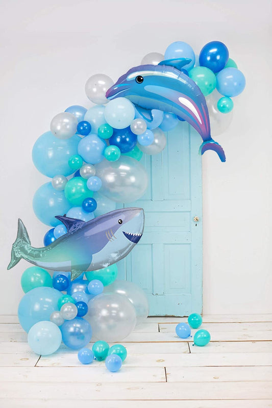 Blue and aqua balloon garland with dolphin and shark balloon accents