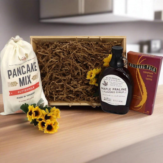 Breakfast gift crate with pancake mix bag, maple syrup bottle, and coffee box
