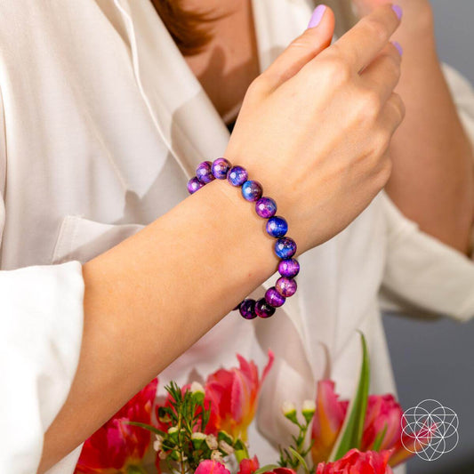 Purple and blue gemstone bead bracelet worn on wrist