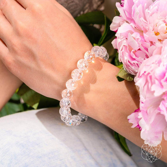 Ice quartz beaded bracelet on a wrist with clear round stones