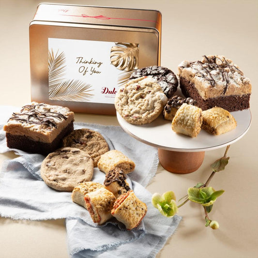 Gourmet bakery tin with “Thinking Of You” card and assorted cookies and bars