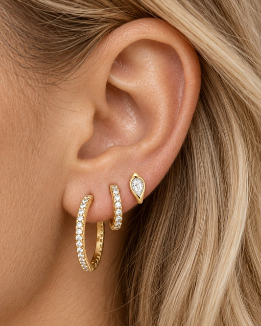 Gold pear-cut huggie hoop earrings with clear crystal teardrop stones