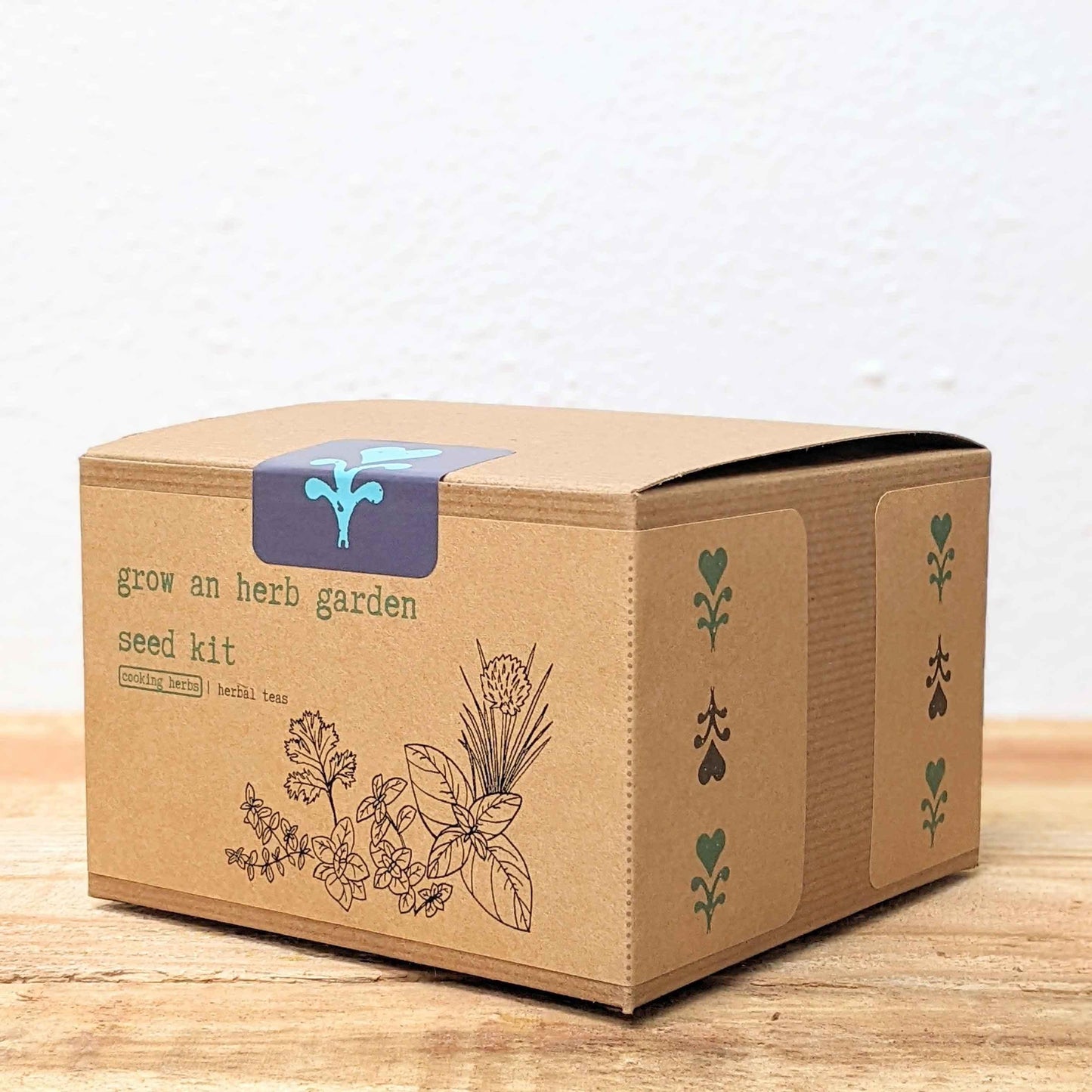 Herb seed kit box angled view with 'grow an herb garden' label and herb icons