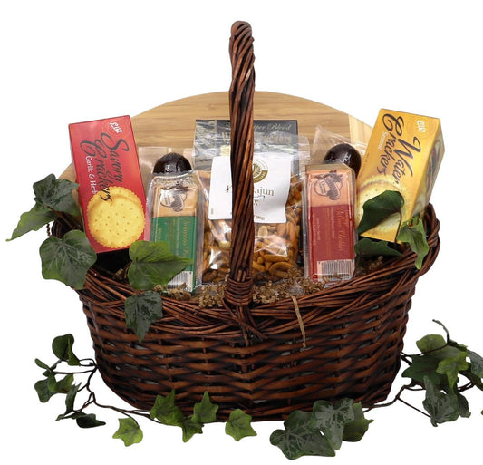 Woven gift basket with wooden insert, assorted cookie and snack packs, and pretzel sticks