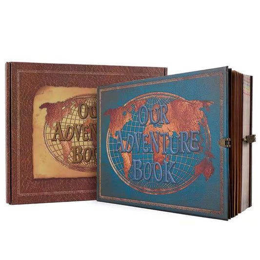 Blue “Our Adventure Book” travel photo album with globe graphic, leather-look cover and lock