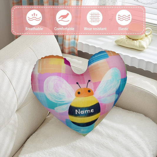 Heart-shaped stuffed bee pillow with pastel wing pattern and dark blue name panel