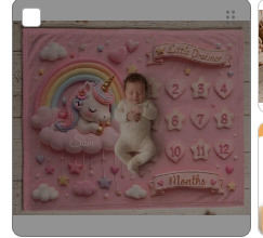 Pink unicorn baby milestone blanket with rainbow and numbered monthly markers