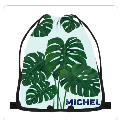 Monstera leaf drawstring bag with black cords and MICHEL name on light aqua